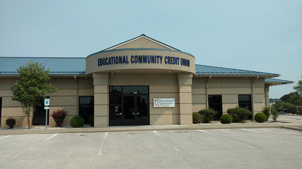 A large building with a sign on the front of it.